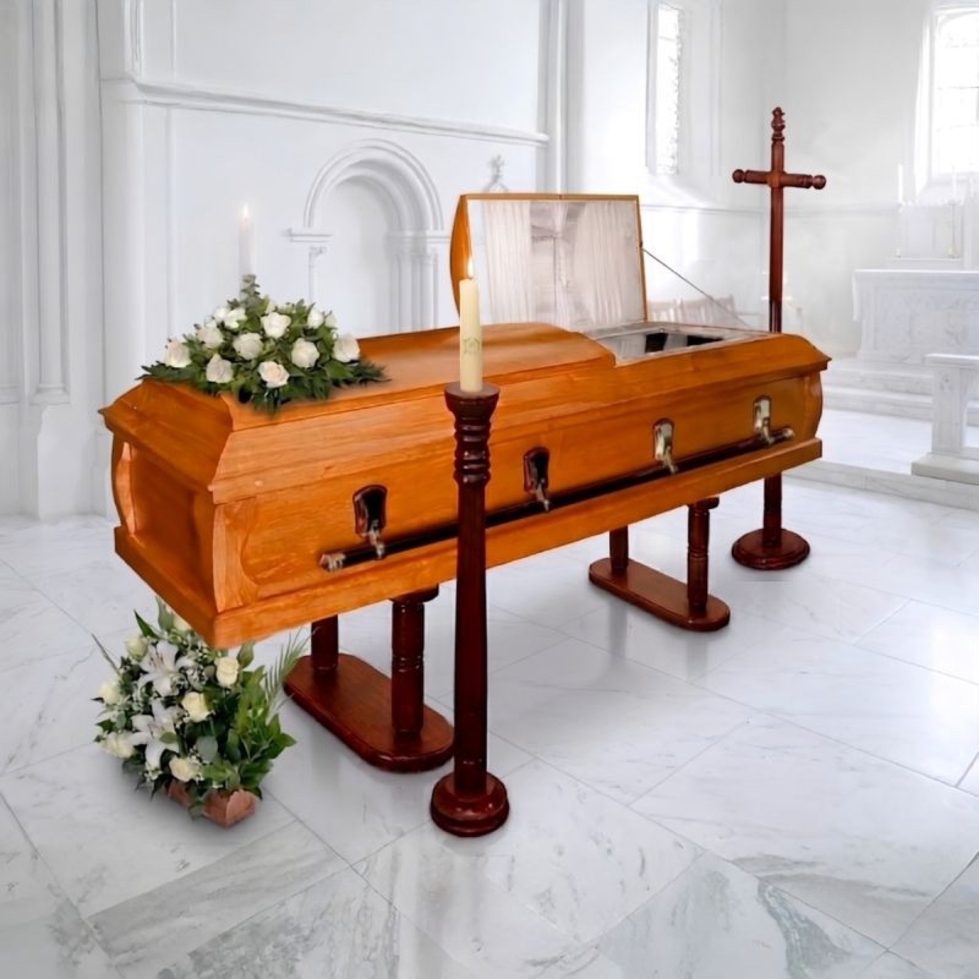 Urna Mackelita en capilla blanca, con un cubre de flores